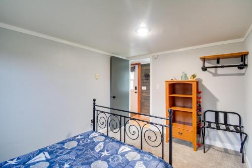 a bedroom with a bed and a shelf at Ocean-Themed Westport Home Bike to Ocean! in Westport