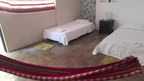 Кровать или кровати в номере casa centro tarapoto 4 habitaciones con amplio jardin y arboles frutales