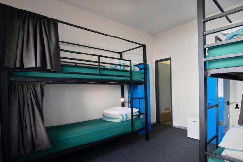 a bunk bed room with two bunk beds at YHA Fremantle Prison in Fremantle