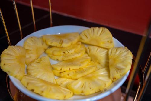 a bowl of sliced banana slices on a table at London Eye Hotel Nuwaraeliya in Nuwara Eliya