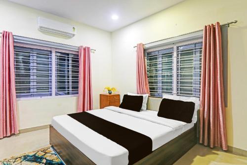 Postel nebo postele na pokoji v ubytování Hotel O New Yatra Residency