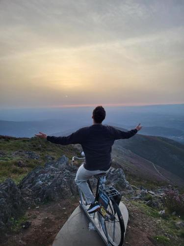 a man riding a bike on top of a mountain at Free Spirit in Vale do Torno