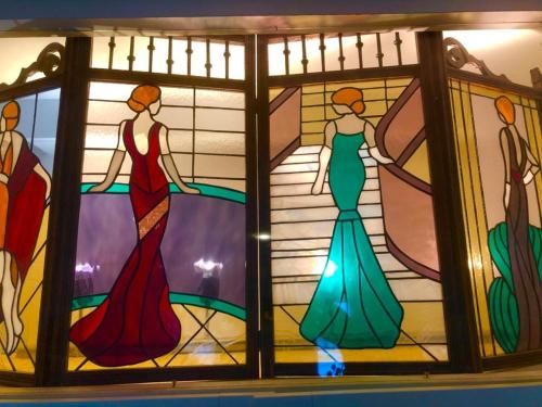 a group of three stained glass windows with three women at Family home, green surroundings, 10 min from Brussels in Overijse