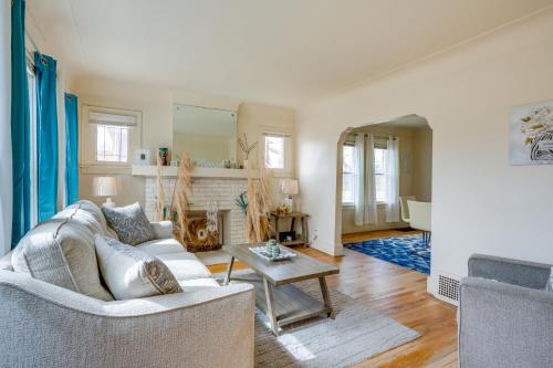 a living room with a couch and a table at Pet-Friendly Detroit Apt Near Motown and DIA in Detroit