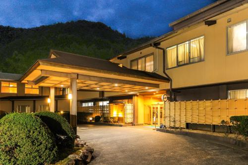 a large building with a driveway in front of it at Ichinomata Onsen Grand Hotel in Shimonoseki