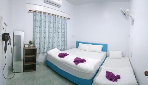 Ένα ή περισσότερα κρεβάτια σε δωμάτιο στο PHP Home Betong พีเอชพี โฮม เบตง