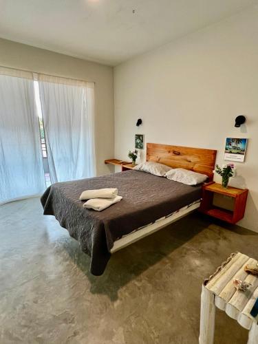 Ένα ή περισσότερα κρεβάτια σε δωμάτιο στο Geko Hostal