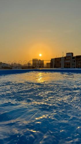 a view of the ocean at sunset from a boat at Hotel Caribe Plaza Barranquilla in Barranquilla