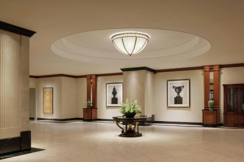 a lobby with a large ceiling with a table in it at Nagoya Marriott Associa Hotel in Nagoya