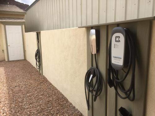 a phone is hanging on the side of a wall at Harbour Inn in Parker