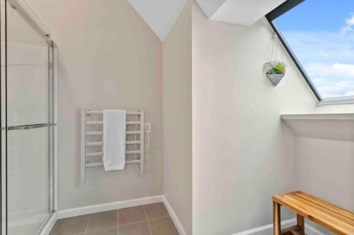 a bathroom with a shower and a window at Stylish Comfort Wooster Square Yale Wi-Fi in New Haven