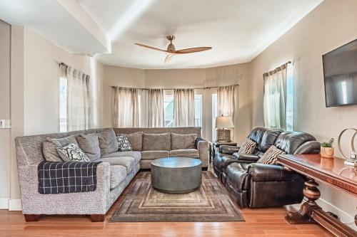 a living room with a couch and a table at Huge Cozy Home with Many Bedrooms in Ivywild in Colorado Springs