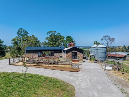 a farm house with a barn and a silo at Rustic Luxury at The Old Dairy Stunning Escape in Glenquarry