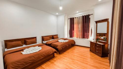Ένα ή περισσότερα κρεβάτια σε δωμάτιο στο Cloud 16 Homestay
