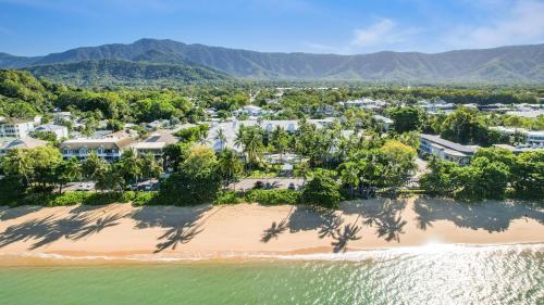 an aerial view of a resort on the beach at Coral Sands Beachfront Resort in Trinity Beach