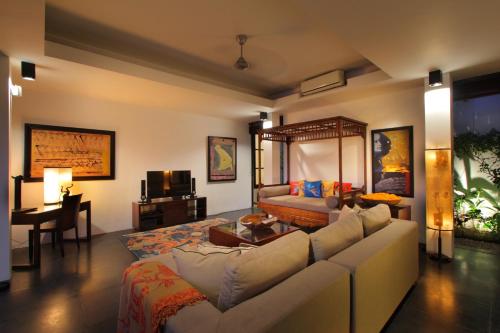 a living room with a couch and a table at Temple Hill Residence Villa in Jimbaran