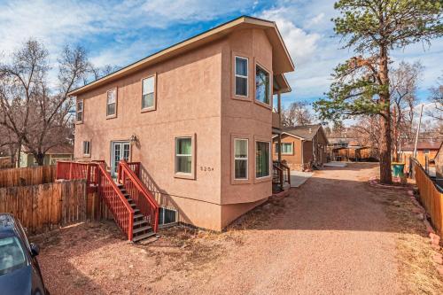 a house with a fence in front of it at Huge Cozy Home with Many Bedrooms in Ivywild in Colorado Springs