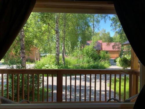 a view from a window of a yard at Susitna River Lodging, Backwoods Cabins in Talkeetna