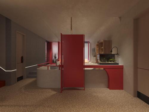 a room with a red refrigerator and a counter at Dali Upland International Youth Hostel, near the south gate of the ancient city ,5 mins walk to the old town, Close to Er Hai Lake, convenient payment and visa cards are accepted in Dali