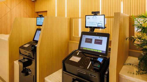 an office with a cash register and a fax machine at JR-East Hotel Mets Tachikawa in Tachikawa