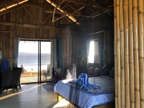 Postel nebo postele na pokoji v ubytování Beach Cabins
