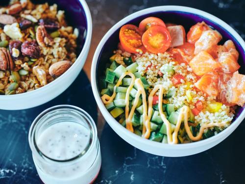 two bowls of food on a table with a jar of sauce at Canopy By Hilton Osaka Umeda in Osaka