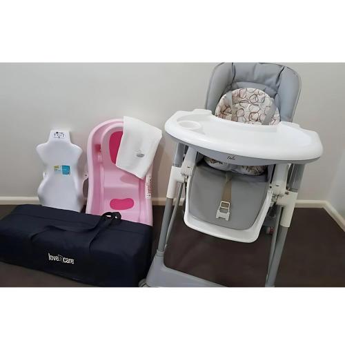 a baby car seat and a high chair at 4 BDR Airconditioned Tropical Escape, Lap Pool & Parking for Caravans, Boats and Trailers in Casuarina