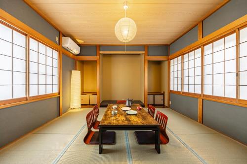 a dining room with a table and chairs at nest Retreat Atami in Atami