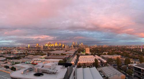 a view of a city with a city skyline at Complete Host Nine Elm Apartments in Melbourne
