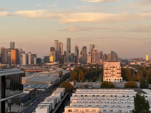a view of a city skyline with tall buildings at Complete Host Nine Elm Apartments in Melbourne