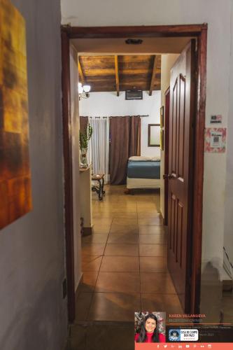 a hallway leading to a room with a bed at Casa de campo Don Paco in Copan Ruinas