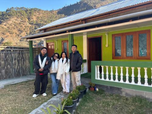 a group of people standing in front of a house at Thupten Homestay, Dirang in Dirang Dzong