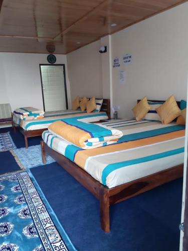 Ένα ή περισσότερα κρεβάτια σε δωμάτιο στο WARUHANG HOMESTAY