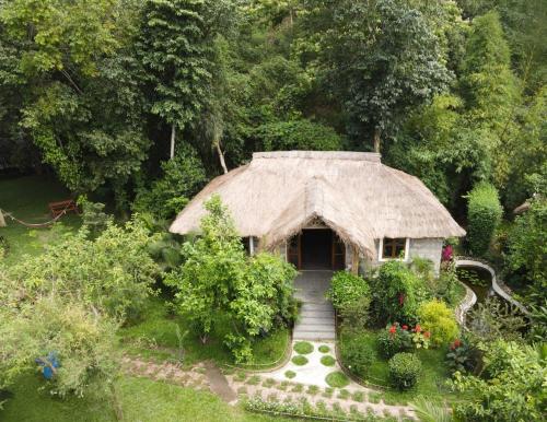 an overhead view of a house with a grass roof at Balishira Resort Ltd. in Sreemangal