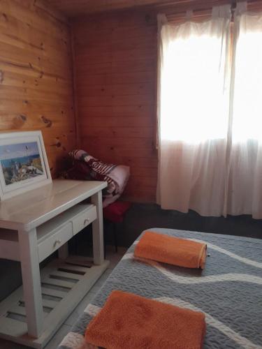 Postel nebo postele na pokoji v ubytování Cabaña Cachi