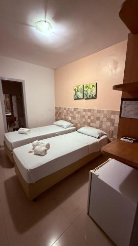 a room with two beds in a room at Hotel Italia Beach - Na Beira Mar Natal RN in Natal