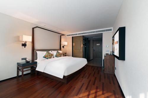 Postel nebo postele na pokoji v ubytování SSAW Hotel (Jiefangbei Hongyadong Branch)