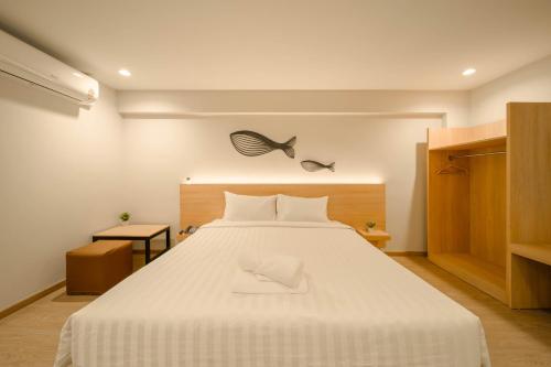 Ένα ή περισσότερα κρεβάτια σε δωμάτιο στο Mintara Hotel - โรงแรมมินธารา มีนบุรี