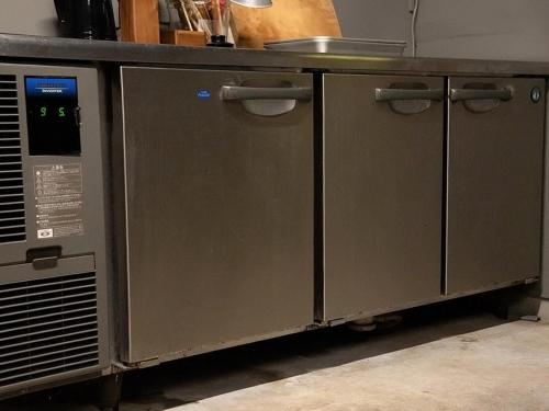 a kitchen with grey cabinets and a counter top at GOYADO in Ozu