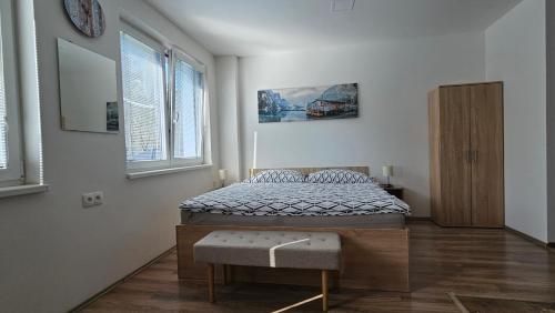 Postel nebo postele na pokoji v ubytování Rezidence Bělehradská