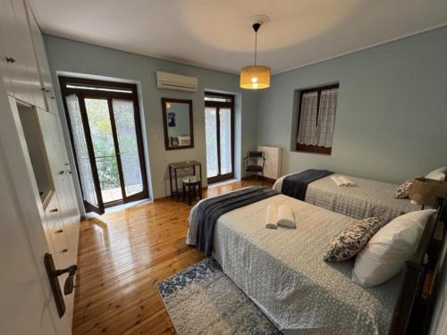 Postel nebo postele na pokoji v ubytování Villa Iris