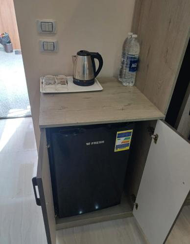 a dishwasher in a kitchen with a counter top at Hurghada Mirage Bay Hotel & Aquapark in Hurghada