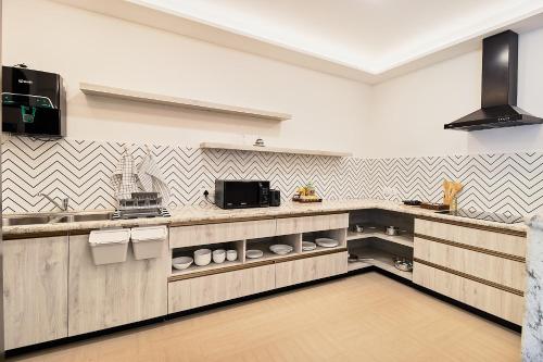 Una cocina o zona de cocina en GoSavvy Executive Residences - Three Bedroom