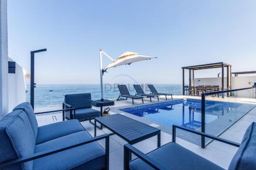 Overlooking Pool, Mountain and Sea 6BR Villa with Two Assistant Room, Heated Pool, BBQ Area, Al Dana Island, Fujairah by Deluxe Holiday Homes