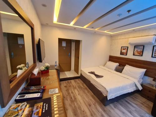 a hotel room with a bed and a television at tourist hotel cairo downtown in Cairo