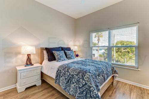 a bedroom with a bed and a window at 2505B W, 5th St condo in Fernandina Beach