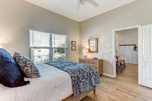 a bedroom with a bed and a window at 2505B W, 5th St condo in Fernandina Beach