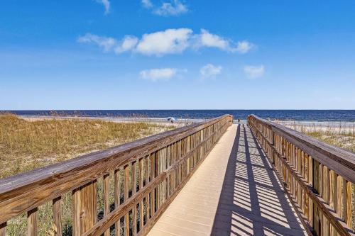 a wooden boardwalk leading to the beach at 2505B W, 5th St condo in Fernandina Beach