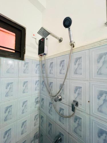 a bathroom with a shower in a room at Zinera Homestay Ahangama in Ahangama