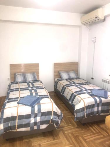 Giường trong phòng chung tại Guest House Sani